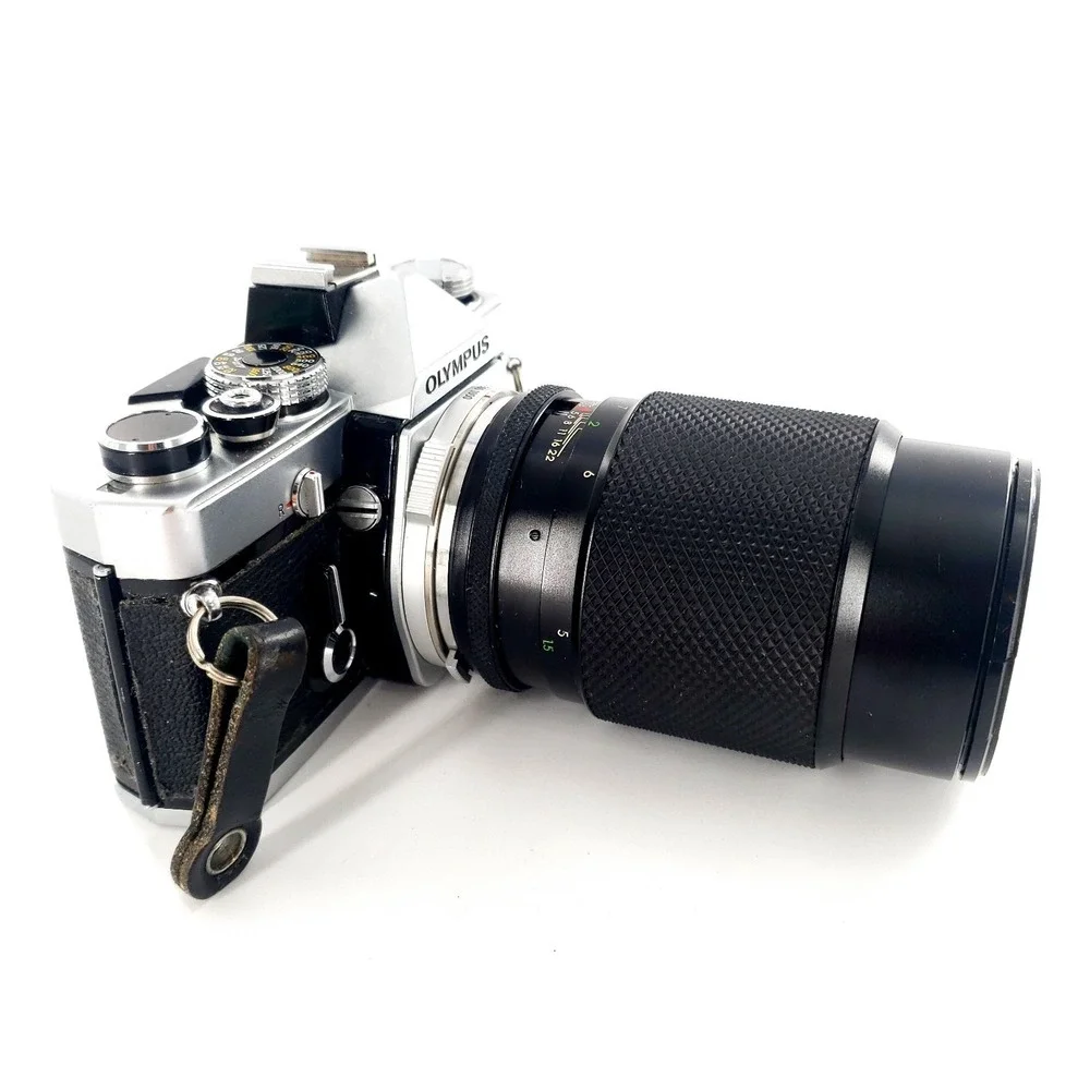 Olympus OM 1 35mm SLR Film Camera with 75-150mm Lens w/ Quantaray 135mm f/2.8